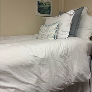 White duvet cover and sheet set includes bed skirt